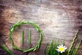 Pause symbol from grass on old wooden background, relaxing in nature concept