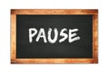 PAUSE text written on wooden frame school blackboard