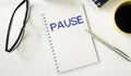 Pause written on a memo at the office Royalty Free Stock Photo