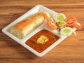 Pav Bhaji is a fast food dish from India, Thick and spicy vegetable curry, served with a soft bread roll or Bun Paav and butter. Royalty Free Stock Photo