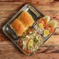 Pav Bhaji is a fast food dish from India, Thick and spicy vegetable curry, served with a soft bread roll or Bun Paav and butter. Royalty Free Stock Photo