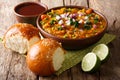 Pav Bhaji with a soft bread roll Bun Paav on table setting, Indian food, Mumbai. Horizontal Royalty Free Stock Photo