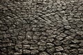 Paved city with porphyry cubes. Texture of cobblestone. Floor of a street with stone tiles.