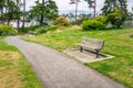 Paved Footpath lined with Wooden Benches