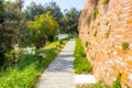 Paved path along the wall of a medieval fortress Royalty Free Stock Photo