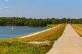 Paved path on top of a levy at Ed Zorinsky lake