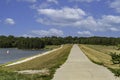 Paved path on top of a levy at Ed Zorinsky lake