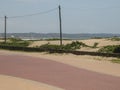 Paved Promenade with Dunes Behind at Durban Beachfront Royalty Free Stock Photo