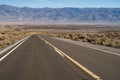 Paved road up to hill Eastern Sierra Nevada mountains Royalty Free Stock Photo