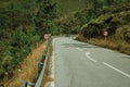 Paved road passing through hilly landscape