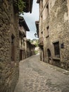 A paved street in the Catalan village of Rupit i Pruit in summer