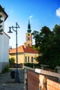 A paved street and a church in the center of Szentendre, a little touristic town near Budapest Royalty Free Stock Photo