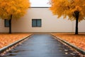 A paved street lined with yellow trees next to a building, AI