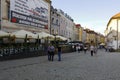 Paved street with people near townhouses