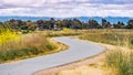 Paved trail following the shoreline of south San Francisco bay area, Mountain View, California Royalty Free Stock Photo