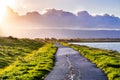 Paved trail illuminated by the evening sunlight on the shoreline of south San Francisco bay area, Mountain View, California Royalty Free Stock Photo