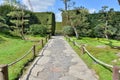 A walkway with roped boundary in a garden