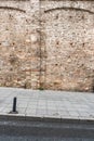 Paved walkway surrounded by ancient stone wall Istanbul, Turkey as background Royalty Free Stock Photo