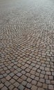 Porphyry stone floor. Pavement of an ancient square in Italy. Sampietrini stones.