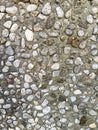 Pavement background made of small pebbles embedded in concrete. Urban stone texture surface used as abstract backdrop for design, Royalty Free Stock Photo