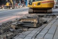 pavement broken and being repaired by a machine