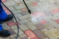 Pavement cleaning with high pressure washer Royalty Free Stock Photo