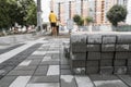 Pavement cobblestone in the stack on the street. Concrete or granite gray square pavement slabs for sidewalk Royalty Free Stock Photo