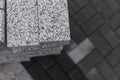 Pavement cobblestone in the stack on the street. Concrete or granite gray square pavement slabs for sidewalk Royalty Free Stock Photo