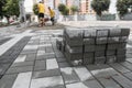 Pavement cobblestone in the stack on the street. Concrete or granite gray square pavement slabs for sidewalk Royalty Free Stock Photo