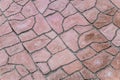 Footpath paved with red tiled stone