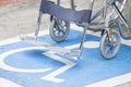 Pavement handicap symbol and wheelchair Royalty Free Stock Photo