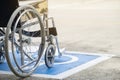 Pavement handicap symbol and wheelchair Royalty Free Stock Photo