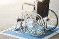 Pavement handicap symbol and wheelchair in the hospital Royalty Free Stock Photo