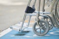 Pavement handicap symbol and wheelchair Royalty Free Stock Photo