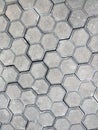 Pavement hexagonal stone background. Hexagonal paving cobble texture laid on city street