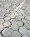 Pavement hexagonal stone background with lines. Hexagonal paving cobble texture laid on city street