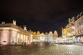 Pavement, historic tenement houses and people at restaurant tables Royalty Free Stock Photo