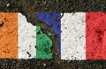 On the pavement are images of the flags of IVORY COAST and France, as a symbol of confrontation.