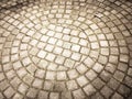 Pavement laid out in a semi-circle and round, smooth stones. Paving stone, tile, semicircle and circle... Royalty Free Stock Photo