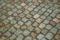 Pavement made of granite setts forming a singular background