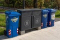 Different trash cans and garbage lockers for recycling in park