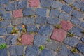 The pavement of red and black natural stones, background