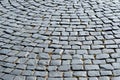 Pavement stone blocks of dark stone of the old part of the city. Textured background Royalty Free Stock Photo