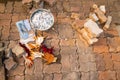 Pavement under construction with pile of paving stones, bucket filled with pebbles, trowel, and gloves. Royalty Free Stock Photo