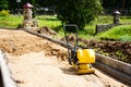 Paver evens out the top layer of sand, builds a path, prepares the road for asphalt.