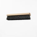 Paver joint cleaning brush floating in mid air horizontally, on solid white background Royalty Free Stock Photo