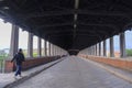 Pavia covered bridge over the Ticino river in cloudy day Royalty Free Stock Photo