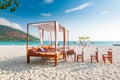 Pavilion chair and wedding arch setup on the beach in a sunny bl Royalty Free Stock Photo