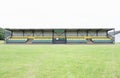 Pavilion sports pitch empty vacant seats cricket rugby football soccer field spectators Royalty Free Stock Photo