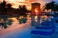 Pavilion on a sunset and the pool with reflection. Royalty Free Stock Photo